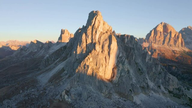 4k drone flight point of view (Ultra High Definition) of Ra Gusela peak. Stunning sunrise in Dolomite Alps. Superb morning scene of Giau pass, Italy, Europe. Beauty of nature concept background.