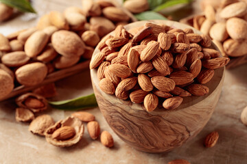 Almond nuts in a wooden bowl.