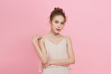  Young Asian beauty woman with korean makeup on face and perfect skin on isolated pink background.