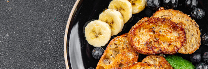 French toast sweet breakfast berries, banana pancakes fresh delicious cooking appetizer meal food snack on the table copy space