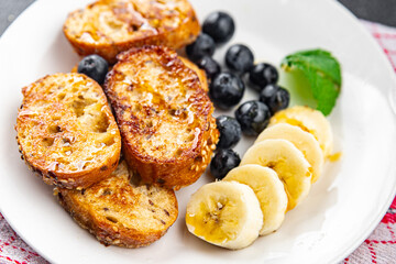 French toast sweet breakfast berries, banana pancakes fresh delicious cooking appetizer meal food snack on the table copy space