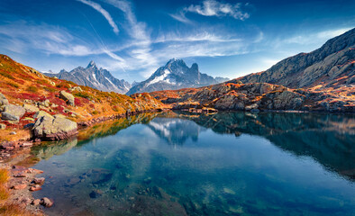 Fototapeta na wymiar Calm autumn view of Chesery lake (Lac De Cheserys), Chamonix location. Exciting morning scene of Vallon de Berard Nature Preserve, Graian Alps, France. Beauty of nature concept background.