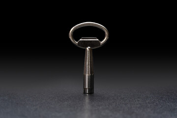 The key on black polished floor.