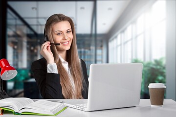 Portrait of business woman, using headset for online communication