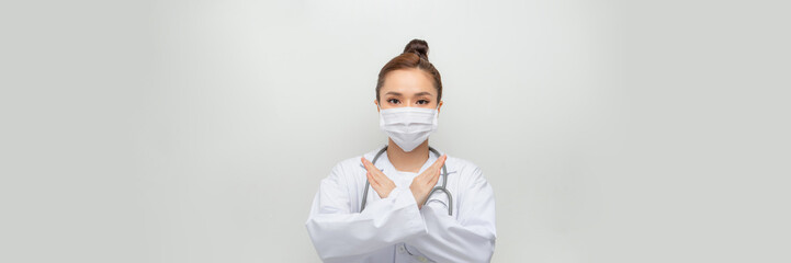 Serious asian woman doctor prohibit patient behavior, showing stop, disapprove smth bad