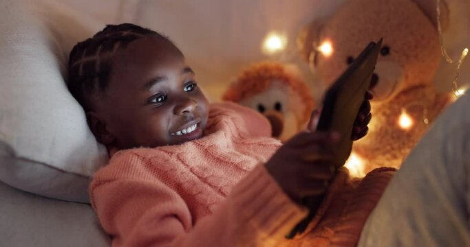 Girl, tablet and child in bedroom at night gaming with online, mobile app or typing on internet, website or social media. African kid, playing and search for games to relax on technology in home