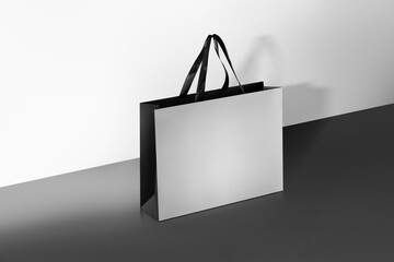 Paper shopping bags mockup with black handles.