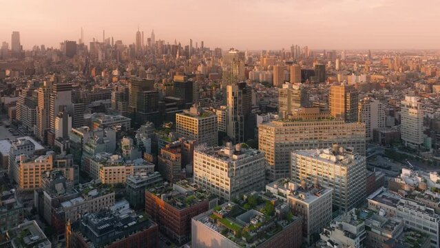 Overhead views of prestige real estate in Tribeca city district in lower Manhattan. NYC cityscape travel destination in America 4K. Aerial view Manhattan streets in golden hour light of scenic sunset
