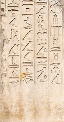Obraz premium Ancient Egyptian hieroglyphs on stone wall, Karnak Temple Complex, Luxor, Egypt, Africa. Stone carvings with hieroglyphs at Karnak temple, Luxor, Thebes
