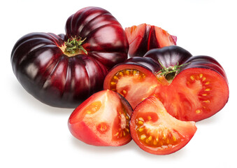 Ripe black or purple tomatoes and tomatoes slices isolated on white background.