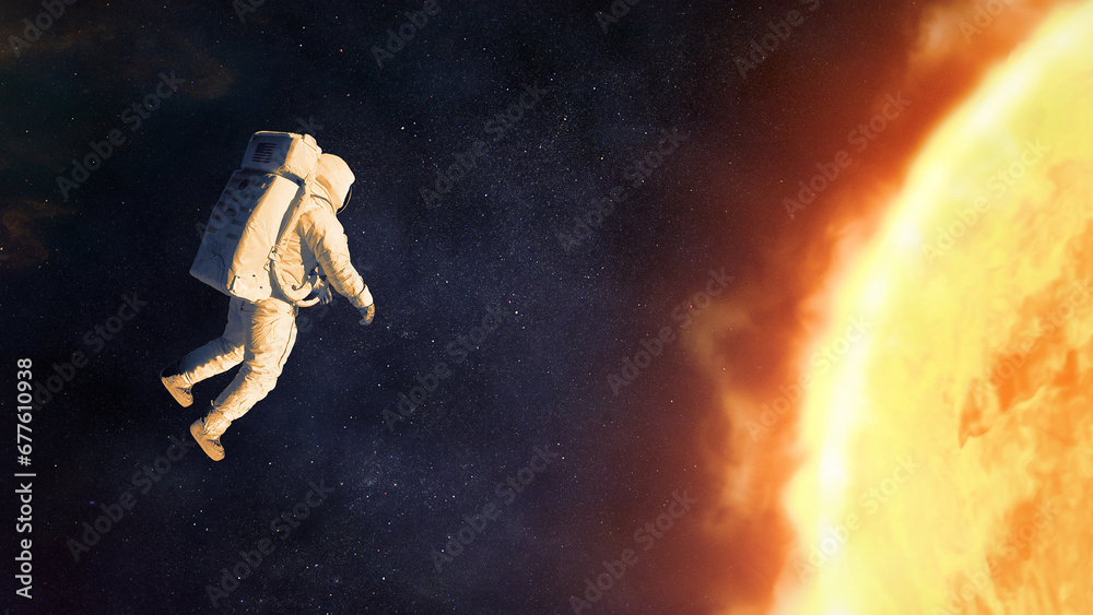 Wall mural spaceman in outer space next to the sun. elements of this image furnished by nasa.