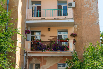 Astrakhan, Russia. Beautiful balcony with flowers. An old house