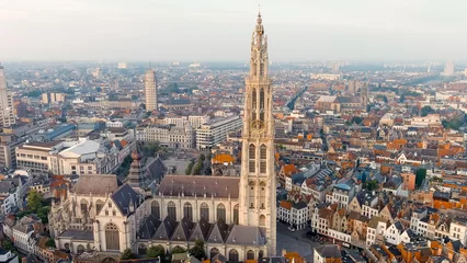 Gardinen Antwerp, Belgium. Spire with the clock of the Cathedral of Our Lady (Antwerp). Historical center of Antwerp. City is located on river Scheldt (Escaut). Summer morning, Aerial View © nikitamaykov