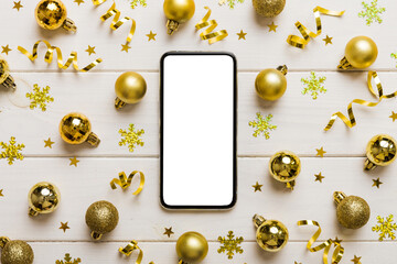 Christmas online shopping from home phone with blank white display top view. smart mobile with copy...