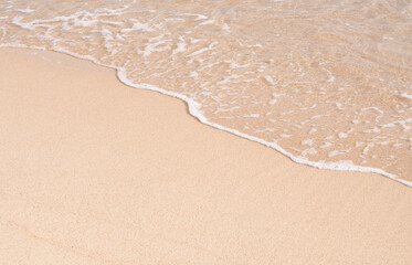 Sand beach texture background,Soft wave of blue ocean on sandy beach for summer background. Tropical White Sand Texture sureface in sunny day spring summer