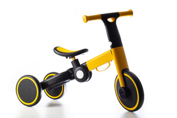 Children's balance bike on a white background, isolate. Children's tricycle. Close-up