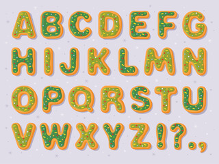 New Year's gingerbread cookies in the form of letters. English alphabet, bold uneven funny font for Christmas card, flyer, banner, poster. Green holiday gingerbread cookies on a gray background