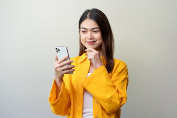 Young Asian women think during using mobile phone