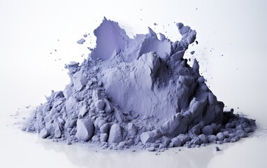 Fototapeta na wymiar A heap of blue matcha with chunks on a white surface.