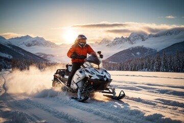 A man wearing an orange jacket, protective helmet and goggles on a snowmobile in winter in the...