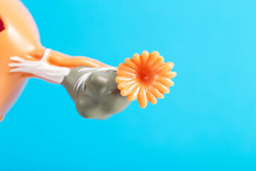 Female ovary close-up on a blue background of a medical mockup. The concept of ovary removal about...