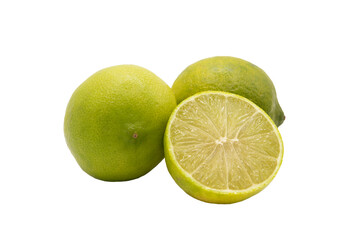 Two lime fruit next to a lime cut in half on a cutout PNG transparent background