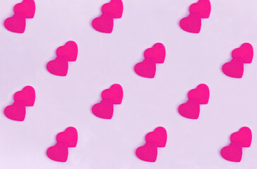 Background for Valentine's day. Pink hearts on the pink background. Flay lay. Pattern.