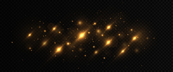 Golden glowing dust. Beautiful light flashes. Dust particles fly in space. Sparkling magical dust particles.