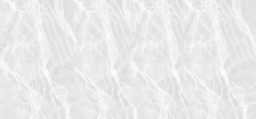 Defocus blurred transparent white colored clear calm water surface texture with splashes reflection. Trendy abstract nature background. Water waves in sunlight with copy space. Gray watercolor shine.