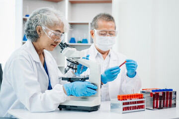 Doctor Talks With Professional Head Nurse or Surgeon, They Use Digital tablet Computer. Diverse Team of Health Care Specialists Discussing Test