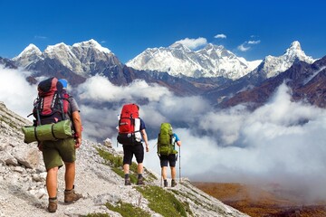 Mount Everest, Mt Ama Dablam, Lhotse peak, three hikers