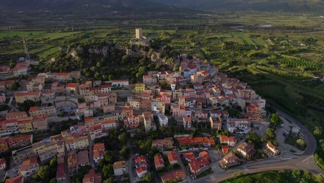 Aerial view over the town of Posada on the island of Sardinia during the golden hour.