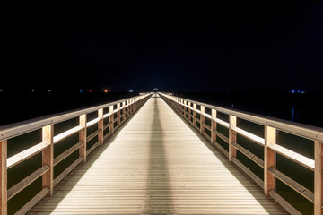 A view of the pier in Ahlbeck on the Baltic Sea at night