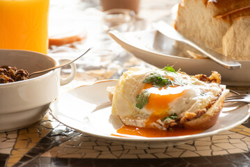 breakfast table with eggs youk bread home and yougurt