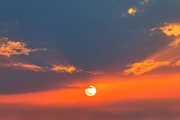 Sunset sky with cloud and sun ray, sunset sky background . Wispy clouds, touched by the fading sunlight