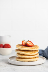 stack of pancakes with strawberries