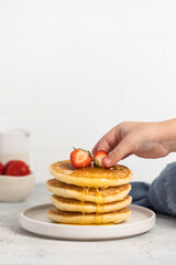 stack of pancakes with strawberries