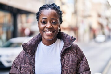 African american woman smiling confident standing at street