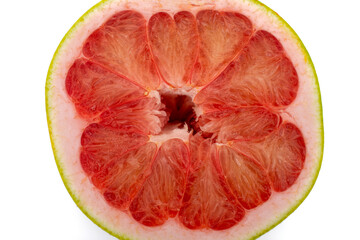 Close up photo of a pomelo grapefruit citrus cross section cut in half showing juicy texture
