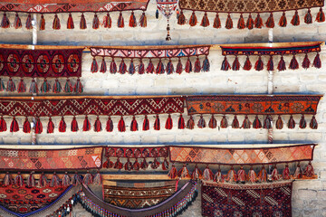 Traditional Uzbek carpets on the wall in a gift shop