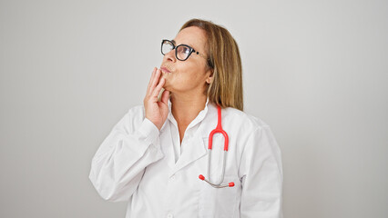 Middle age hispanic woman doctor standing with doubt expression thinking over isolated white background