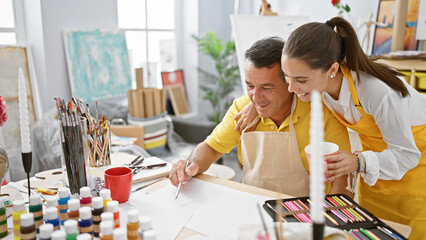 Man and woman artists joyfully drawing, sharing a cup of coffee together in the vibrant atmosphere...