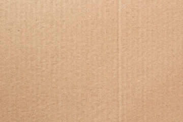 Cardboard sheet texture background, detail of recycle brown paper box pattern.