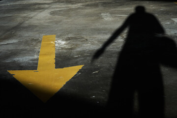 shadow arrow on the road