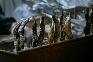 Ayu fish cooked on the grill in a street food stall in Japan.