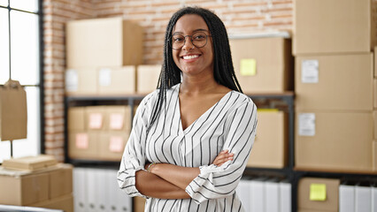 African american woman ecommerce business worker standing with arms crossed gesture at office