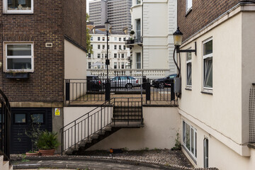 Looking between buildings into urban London neighborhood