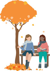 Two female-looking friends chat on a park bench, in an autumn atmosphere with fallen leaves