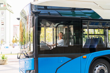 Woman bus driver. Young adult female person drives trolley bus.