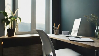 Workplace with white chair at wooden drawer writing desk against of window near dark grey wall Interior design of modern scandinavian home office